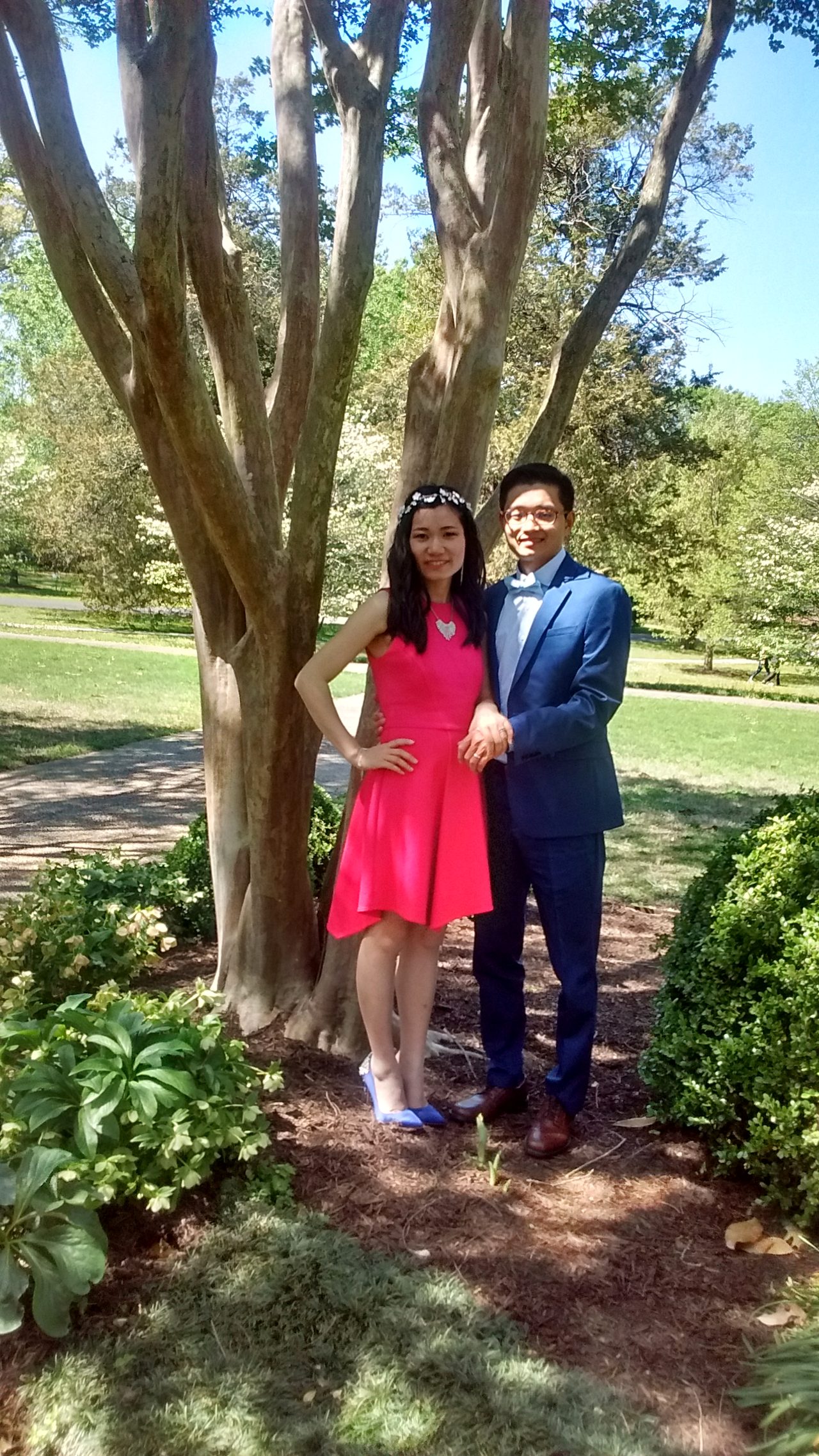 Couple under the trees in a garden setting